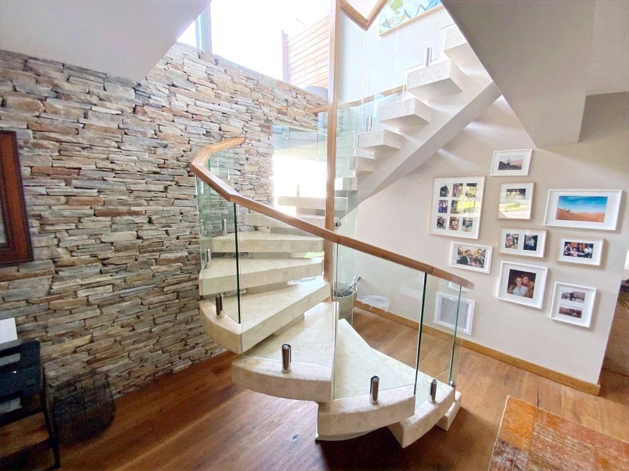 Frameless glass balustrade on a curved feature staircase